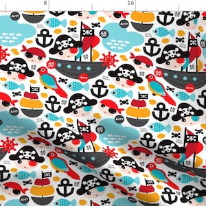 May include: A white fabric with a repeating pattern of cartoon pirates, ships, anchors, parrots, and fish. The pirates wear skull-and-crossbones hats and eye patches. The color palette includes red, black, yellow, blue, and white.