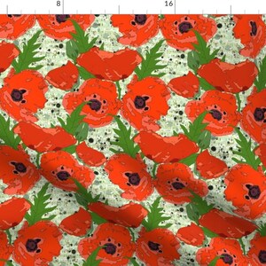 May include: A seamless pattern featuring red poppy flowers with green leaves on a white background with black and white speckles.