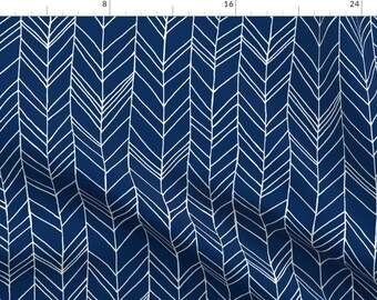 May include: A navy blue fabric with a white herringbone pattern. The pattern is made up of thin lines that create a chevron design.