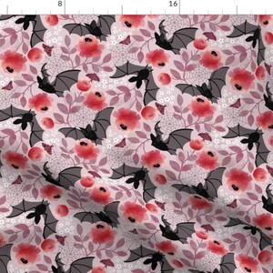May include: A seamless pattern featuring black bats flying amongst pink and red watercolor flowers on a light pink background.