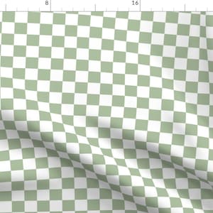 May include: A green and white checkered pattern fabric. The fabric is folded and has a slight wrinkle.