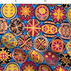 Peut inclure: Un motif sans couture d'œufs de Pâques colorés et géométriques sur un fond bleu vif. Les œufs sont décorés de différents motifs, notamment des étoiles, des fleurs et des formes géométriques.