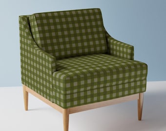 May include: A green and white gingham armchair with wooden legs. The chair has a high back and a wide seat.