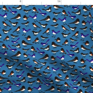 May include: A seamless pattern featuring a repeating design of black and white birds with blue accents on a solid blue background.