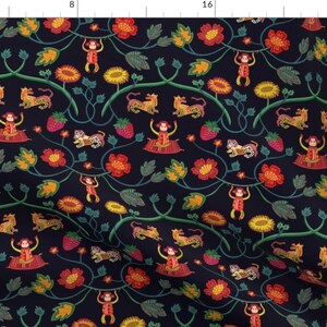 May include: A dark blue fabric with a repeating pattern of monkeys, tigers, flowers, and leaves. The monkeys are swinging from vines and the tigers are walking on the ground. The flowers are red, yellow, and orange. The leaves are green.