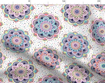 May include: A white background with a repeating pattern of colorful mandalas. The mandalas are in shades of pink, blue, yellow, and green. The background is dotted with small white dots.