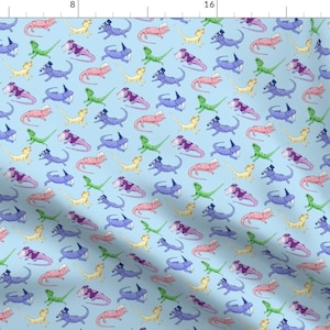 May include: A repeating pattern of colorful lizards wearing hats on a light blue background. The lizards are in various poses and colors, including pink, purple, blue, green, and yellow.