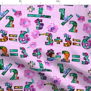 May include: A pink fabric with a repeating pattern of colorful numbers, flowers, and animals. The numbers are surrounded by green leaves and flowers. The text "Three plus three equals six" is repeated throughout the fabric.