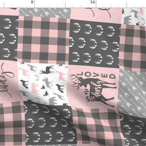 May include: Pink and gray patchwork fabric with a variety of patterns, including buffalo plaid, antlers, arrows, and the text "Little Lady" and "You are so dearly loved".