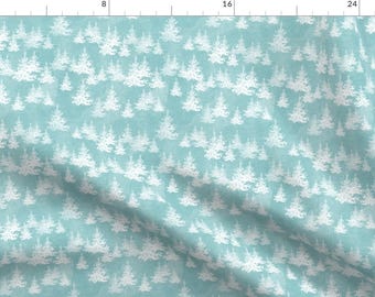 May include: A seamless pattern featuring white silhouette Christmas trees on a light blue background. The pattern is perfect for holiday crafts and projects.