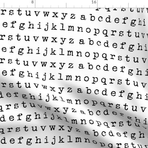 May include: A white background with a repeating pattern of black letters from the alphabet. The letters are in a typewriter font.