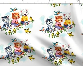 May include: A white background with a repeating pattern of three kittens sitting on a branch with birds. The kittens are wearing different colored clothing and the birds are blue, yellow, and green.