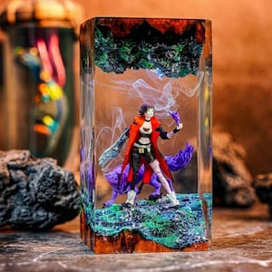 May include: A set of three ceramic mugs with a speckled, matte finish. The mugs are in shades of cream, light gray, and dark gray. Each mug has a simple, minimalist design, perfect for coffee or tea.