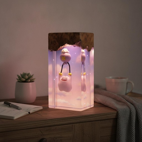 Ditto and Drifloon cast in glowing resin — a Pokémon lamp that's genuinely handmade, not merch-store slop.