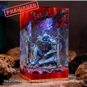 May include: A blue and silver knight figurine with a sword, encased in a clear resin block. The resin has red and purple accents, with the text "PRE-ORDER" in a red banner. The base is brown. The text at the bottom says "This picture is a mock-up for preorder."