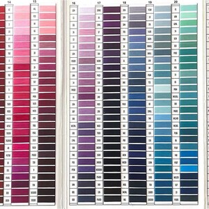 May include: A color chart with rows of thread samples in various shades of red, pink, purple, blue, green, and brown. The chart is divided into sections with numbers 11 through 23.