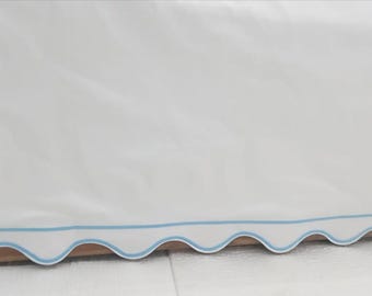 Scalloped and Border Embroidery Crib skirt White 100% Cotton Sateen Crib skirt with split corners; 4-sided skirt fits around the entire crib
