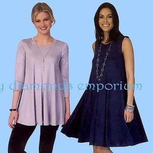 May include: Two women modeling dresses. One wears a light purple tunic with three-quarter sleeves and black leggings. The other wears a navy blue sleeveless dress. The text "y diamonds emporium" is visible.