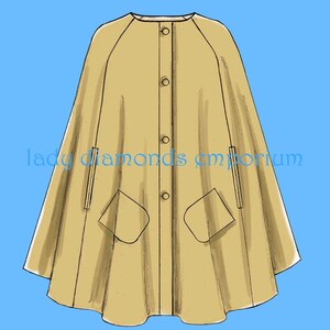 May include: A tan cape with a round neckline, button fastening, and two front pockets. The cape has a flowing design and is set against a blue background. The text "lady diamonds emporium" is printed on the cape.