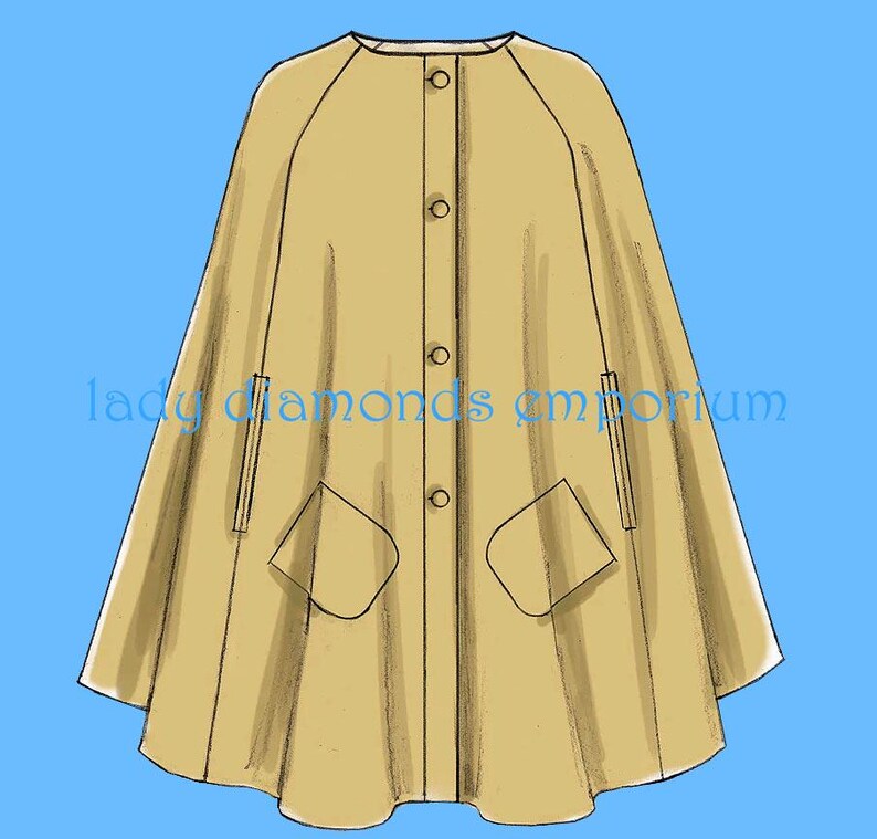 May include: A tan cape with a round neckline, button fastening, and two front pockets. The cape has a flowing design and is set against a blue background. The text "lady diamonds emporium" is printed on the cape.