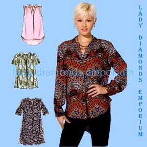May include: A woman wearing a long-sleeved, patterned blouse with black pants. The image also shows three different blouse designs: a sleeveless pink top, a short-sleeved green and blue patterned top, and a dark floral print top. The text "LADY DIAMONDS EMPORIUM" is visible.