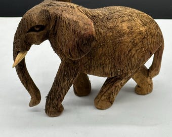 Vintage handcarved wooden elephant. RARE. Unusual texture. Tusks.