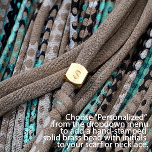 Instructions to personalize your piece with a hand-stamped brass bead.