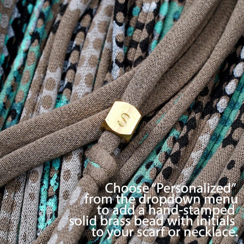 Instructions to personalize your piece with a hand-stamped brass bead.