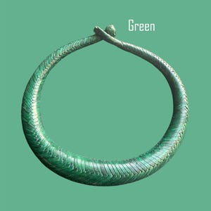 May include: A green, braided necklace with a textured surface. The necklace is circular and has a clasp at the top. The word "Green" is displayed in white text.