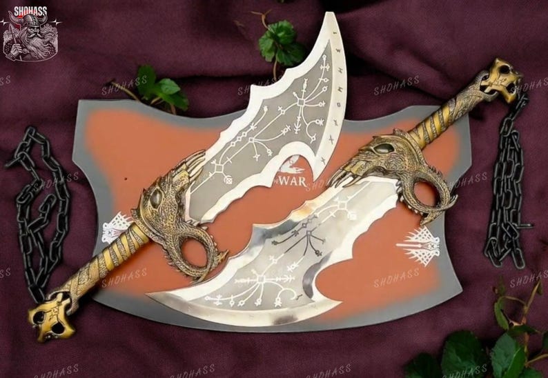 May include: A pair of silver and gold-colored swords with intricate designs and chains. The swords are displayed on a brown and gray background with the word "WAR" printed on it.