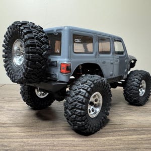 Porte-roue de secours SCX24