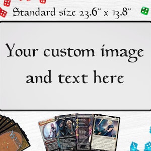 May include: A white rectangular game mat with a black border, featuring the text "Your custom image and text here." The mat measures 23.6" x 13.8". Several trading cards and dice surround the mat, suggesting a gaming theme.