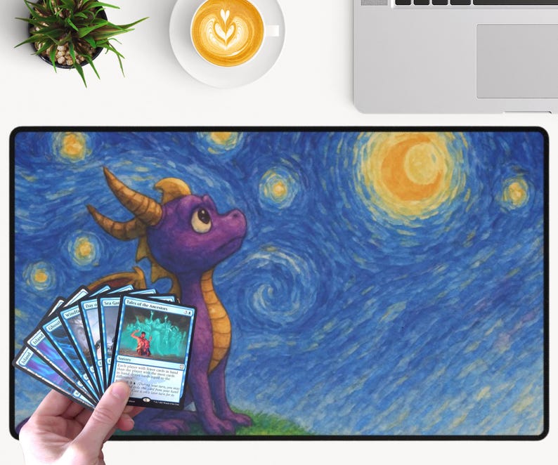 May include: A large rectangular mousepad featuring a purple dragon character set against a starry night sky background. The dragon is looking up, and a hand holds a fan of trading cards in front of the dragon. The background is a stylized painting.