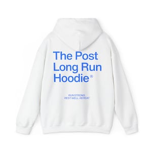 May include: White hoodie with blue text that reads "The Post Long Run Hoodie" and "Run Strong. Rest Well. Repeat." The hoodie has a hood and long sleeves. The design is simple and modern.