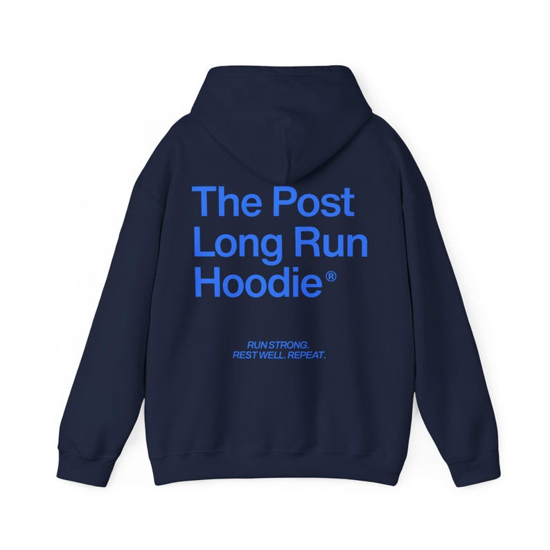 May include: Navy blue hoodie with the text "The Post Long Run Hoodie" in blue block letters on the back. Below the text is the phrase "Run Strong. Rest Well. Repeat."