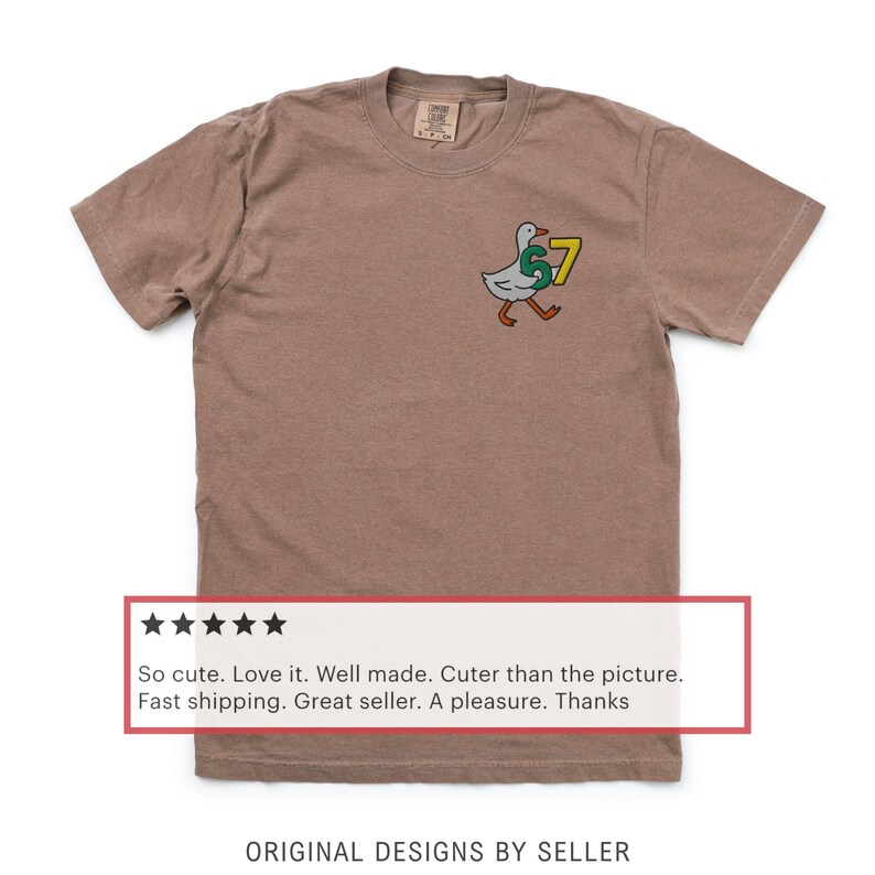 May include: A brown t-shirt with a cartoon goose wearing a "57" jersey. The goose is white with a green "5" and a yellow "7". The text "ORIGINAL DESIGNS BY SELLER" is at the bottom.