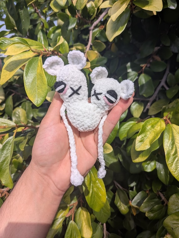 A handmade crochet 'cursed' doll with intentional creepy-cute wrongness — the kind of oddity you genuinely can't buy at any store.