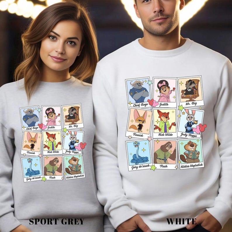 Puede incluir: Sudaderas grises deportivas y blancas con retratos de personajes de dibujos animados. Cada sudadera muestra nueve im&aacute;genes de personajes con nombres como "Chief Bogo", "Judith" y "Mr. Big". La parte inferior de las sudaderas dice "SPORT GREY" y "WHITE".