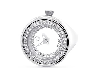May include: A silver ring watch with a white face and a diamond-encrusted bezel. The watch face has a small diamond at the 12 o'clock position and the word "MOJID" printed on the face.