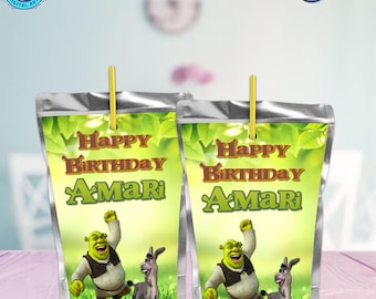 May include: Two green and silver juice boxes with a Shrek and Donkey cartoon design. The boxes have the text "Happy Birthday Amari" on them.