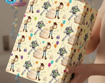 May include: A wrapped gift featuring a repeating pattern of cartoon characters, birthday cakes, and balloons on a light yellow background. The characters include a cowboy and a space ranger. The gift is held by a person.