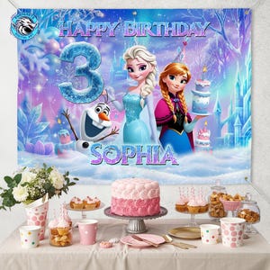 May include: A colorful birthday banner featuring the characters Elsa, Anna, and Olaf from the movie Frozen. The banner reads "Happy Birthday" and includes the name "Sophia" and the number "3". The banner is decorated with a winter wonderland theme.