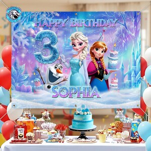 May include: A banner with the text "HAPPY BIRTHDAY" and the number "3" in a blue, icy font. The banner features illustrations of Elsa, Anna, and Olaf from the movie Frozen, with the name "SOPHIA" below. Balloons and a birthday cake are also visible.