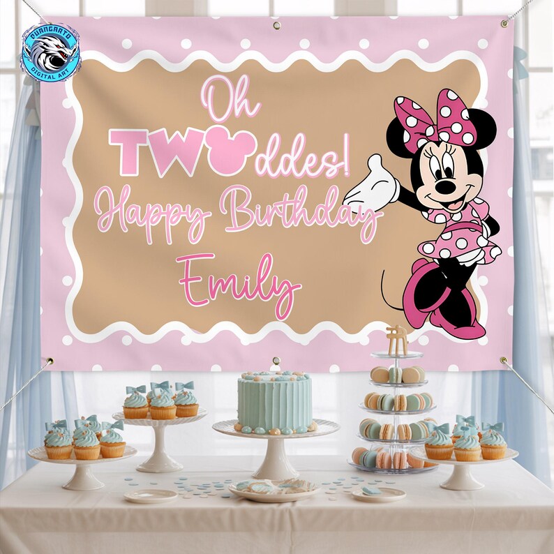 May include: A rectangular pink and tan birthday banner featuring a cartoon mouse in a polka dot dress, the text Oh TWOddes! Happy Birthday Emily, and metal grommets in the corners. The banner is displayed above a table with a cake and desserts.