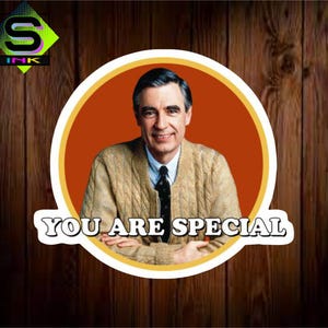 May include: A sticker featuring a portrait of Fred Rogers inside a circular design with an orange background and the text "YOU ARE SPECIAL". The sticker has a wooden background and the S Ink logo.