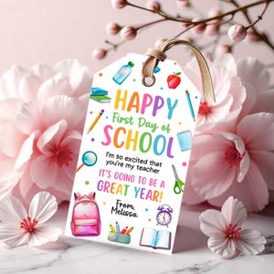 May include: A rectangular gift tag with a tan string featuring the text HAPPY First Day of SCHOOL, I'm so excited that you're my teacher, IT'S GOING TO BE A GREAT YEAR! From, Melissa. Illustrations include a backpack, books, pencil, and clock.