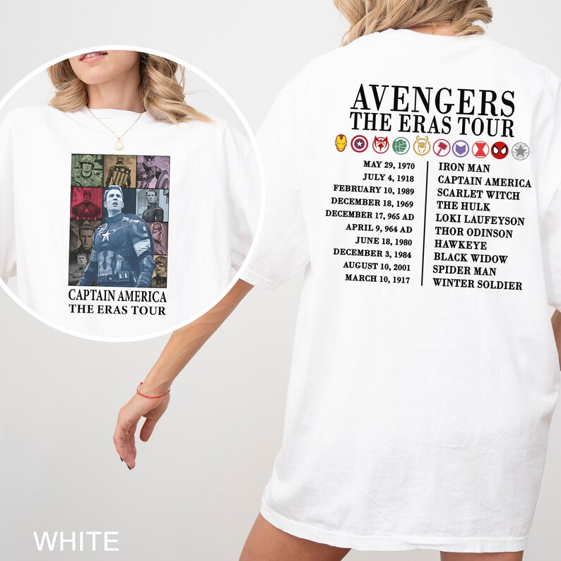 May include: White t-shirt featuring a Captain America graphic on the front and "Avengers The Eras Tour" text on the back. The back also lists character names and dates. The shirt is a casual style.