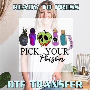 May include: White t-shirt featuring a graphic design with the text "PICK YOUR POISON". The design includes illustrations of poison bottles, a skull-shaped apple, and the words "READY TO PRESS" and "DTF TRANSFER".