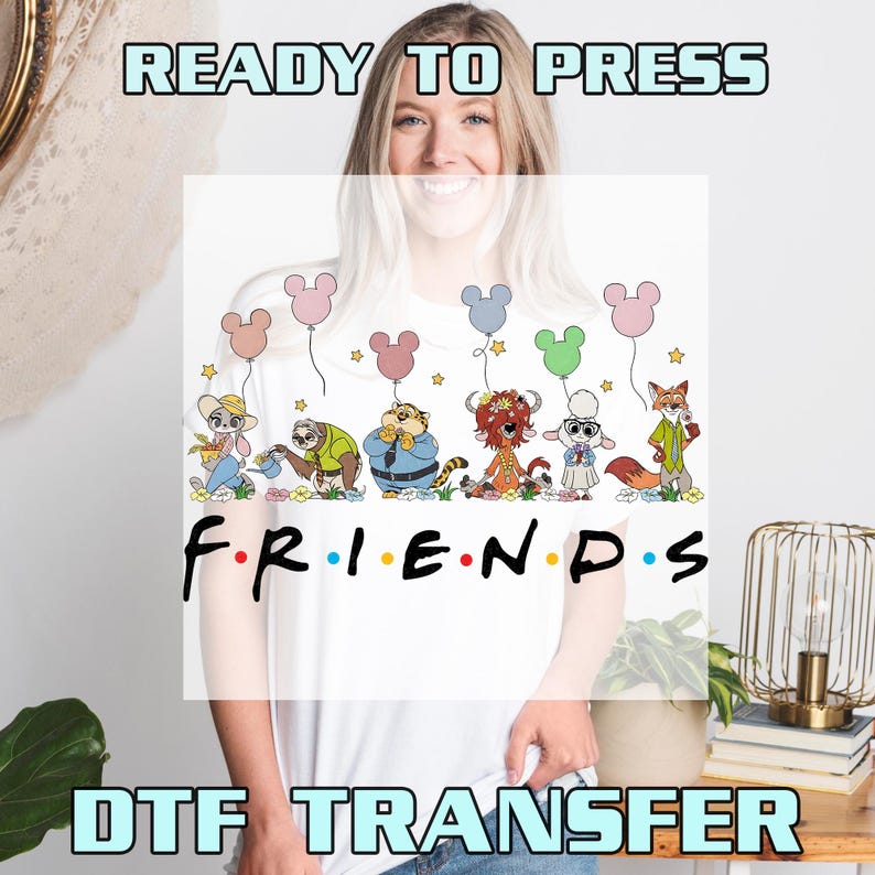 May include: White t-shirt featuring a colorful graphic of cartoon characters holding Mickey Mouse-shaped balloons, with the word "FRIENDS" in the style of the TV show logo. The words "READY TO PRESS" and "DTF TRANSFER" are also visible.