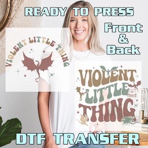May include: White t-shirt with a front and back design. The front design features the text "VIOLENT LITTLE THING" with a dragon graphic. The back design has the same text and dragon graphic. The words "READY TO PRESS" and "DTF TRANSFER" are also visible.